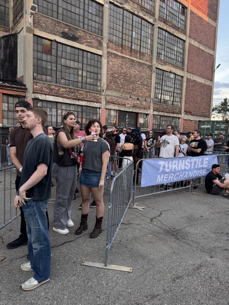 Fans waiting in line at an official merchandise stand